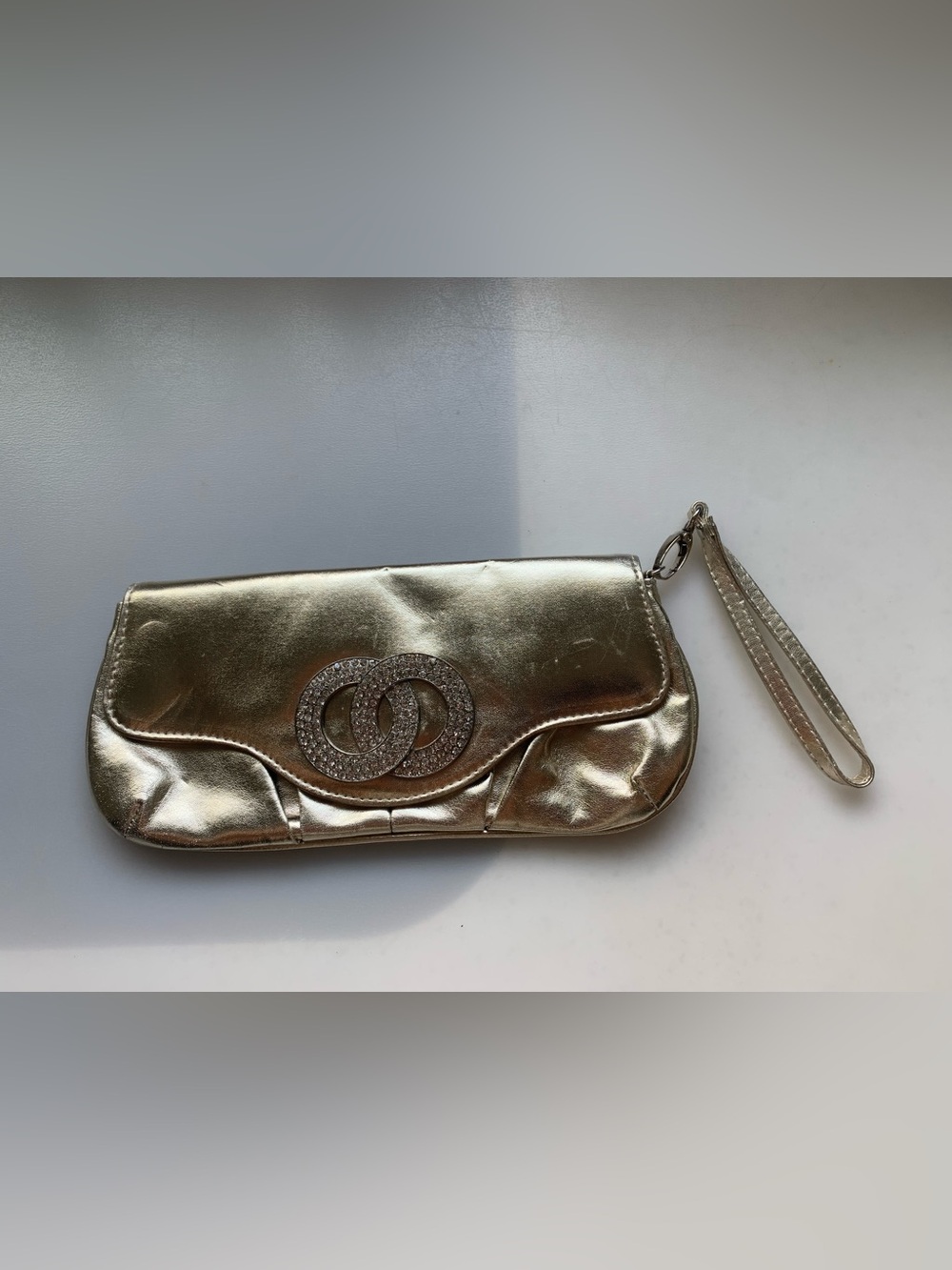 Call It Spring Metallic Gold Wristlet with Crystal Double-Ring Accent